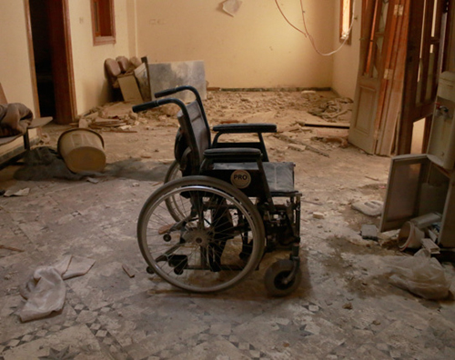 A wheelchair is seen inside the Sahra Hospital after a reported barrel bomb strike by Syrian regime forces over the Sahur neighbourhood of Aleppo, Syria, on Saturday (Anadolu Agency photo)